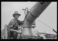 Adjusting straw stacker or grain separator, Ohio. Sourced from the Library of Congress.