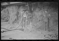 Baled straw to be used for making strawboard at Container Corporation of America; makes paper out of straw. Circleville, Ohio. Sourced from the Library of Congress.