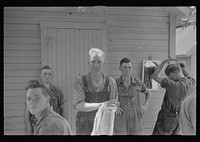[Untitled photo, possibly related to: Waiting around before dinner during wheat harvest, central Ohio]. Sourced from the Library of Congress.