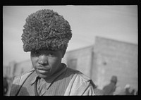  with a fur cap, a flood refugee in the camp at Forrest City, Arkansas. Sourced from the Library of Congress.