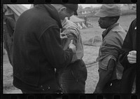 [Untitled photo, possibly related to: Vaccination in the camp for  flood refugees at Marianna, Arkansas]. Sourced from the Library of Congress.