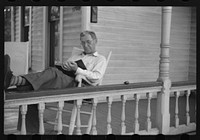 [Untitled photo, possibly related to: Front porch. Sunday afternoon, Vincennes, Indiana]. Sourced from the Library of Congress.