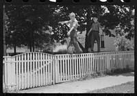 Boys walking fence. Washington, Indiana. Sourced from the Library of Congress.