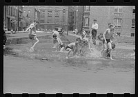 [Untitled photo, possibly related to: Cooling off in water from hydrant, Chicago, Illinois]. Sourced from the Library of Congress.