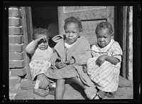 youngsters in doorway of alley dwelling. Washington, D.C.. Sourced from the Library of Congress.