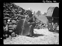 Sharpening a saw. Pine Ridge land use project. Dawes County, Nebraska. Sourced from the Library of Congress.