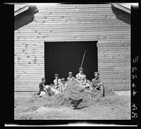 Rehabilitation family before nearly-built barn. Ada County, Idaho. Sourced from the Library of Congress.