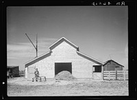 New barn which rehabilitation built with loan of four hundred and fifty dollars. Old barn in background. Ada County, Idaho. Sourced from the Library of Congress.