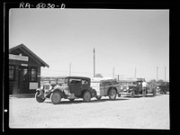 Everyday from twenty to thirty cars moving out from the Dakotas pass the Montana Highway Department's port of entry. Montana. Sourced from the Library of Congress.