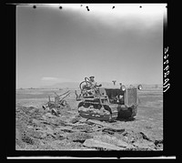 Resettled farmer breaking up new land for farming. Bosque Farms, New Mexico. Sourced from the Library of Congress.