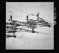 Dust covering farm implements. Castro County, Texas. Sourced from the Library of Congress.