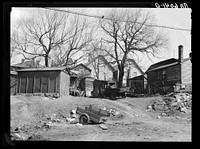 Closeup of rear of houses in 900 block on West Clyburn Street. Milwaukee, Wisconsin. Sourced from the Library of Congress.