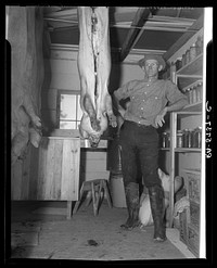 C.D. Grant in storehouse on his farm at Penderlea Homesteads. North Carolina. Sourced from the Library of Congress.