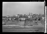 Backyards and house in Birmingham, Alabama, district from which have come some of the residents of the housing project. Sourced from the Library of Congress.