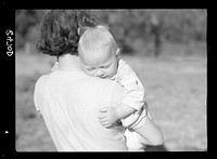 Wife and child of farmer. Irwinville Farms, Georgia. Sourced from the Library of Congress.