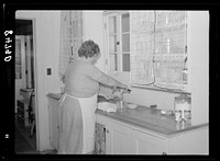 Mrs. Carrol in her kitchen at Irwinville Farms, Georgia. Sourced from the Library of Congress.