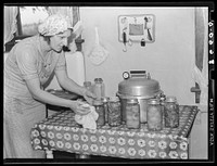 Rehabilitation client and canned goods. Lancaster County, Nebraska. Sourced from the Library of Congress.