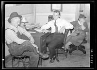 Farmer applying to county supervisor for Farm Security Administration loan. Oskaloosa, Kansas. Sourced from the Library of Congress.