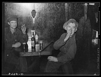 Farmer and old cowboy in North Platte, Nebraska, saloon. Sourced from the Library of Congress.