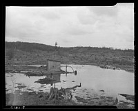 Water supply and cut-over land on the road into Kempton, West Virginia. Sourced from the Library of Congress.