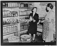 Nothing wrong with these shelves. Shelves like these may be built in a well-ventilated cellar, cave, or closet where it is cool, but not cold enough to freeze, and where there is no strong light. They are wide enough, they are built of strong boards, and they are braced with sturdy supports. One hundred feet of twelve-inch shelving will hold five hundred jars. Notice the orderly arrangement of jars. All foods of one kind are together. Sourced from the Library of Congress.