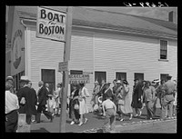 Tourists, fresh off the boat from Boston. With only two hours in town, they buy seashells, dinners, trinkets, and rides on the sightseeing bus.  Provincetown, Massachusetts. Sourced from the Library of Congress.