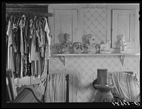 Tourist house, Truro. Interior of tourist bedroom. Clothes and half-filled whisky glass belong to tourists. Truro, Massachusetts. Sourced from the Library of Congress.