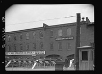 Sign showing some of the present uses of products of Amoskeag mills. Manchester, New Hampshire. Sourced from the Library of Congress.