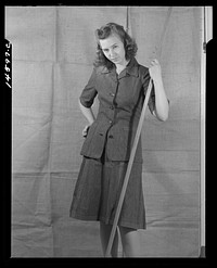 Washington, D.C. Modeling denim dress worked out for a high school girl on a low income by graduate students of the Department of Clothing and Textiles, School of Home Economics, University of Alabama. Sourced from the Library of Congress.