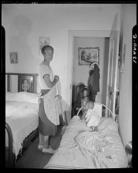 Washington, D.C. Grandchild of Mrs. Ella Watson, a government charwoman, taking her afternoon nap. Sourced from the Library of Congress.