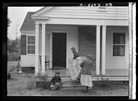 [Untitled photo, possibly related to: The Eargle family moving into their new house at Gardendale, Alabama]. Sourced from the Library of Congress.