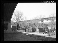 [Untitled photo, possibly related to: Housing under Wisconsin Avenue viaduct. Milwaukee, Wisconsin]. Sourced from the Library of Congress.
