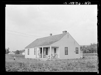 [Untitled photo, possibly related to: Five-room house and family at the Palmerdale Homesteads near Birmingham, Alabama]. Sourced from the Library of Congress.