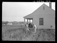 [Untitled photo, possibly related to: Five-room house and family at the Palmerdale Homesteads near Birmingham, Alabama]. Sourced from the Library of Congress.