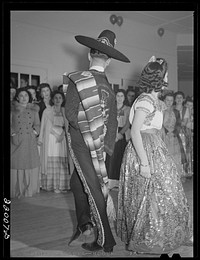 [Untitled photo, possibly related to: Brownsville, Texas. Charro Days fiesta. Dancing the jarabe tapatia at Triple L Club dance]. Sourced from the Library of Congress.