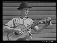 Weslaco, Texas. FSA (Farm Security Administration) camp. Boy musician. Sourced from the Library of Congress.