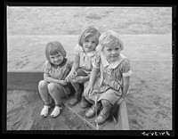 Children playing in sandbox. Tulare migrant camp. Visalia, California. Sourced from the Library of Congress.