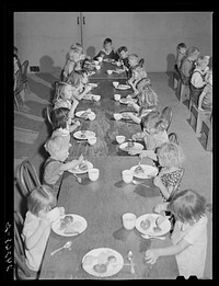 Children eating in nursery. Tulare migrant camp. Visalia, California. Sourced from the Library of Congress.