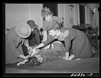 [Untitled photo, possibly related to: Civilian Defense volunteers receiving instruction in treatment of fractured arm. First aid class. American Red Cross, New York City]. Sourced from the Library of Congress.
