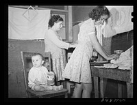 [Untitled photo, possibly related to: Family preparing tortillas for supper. Robstown camp, Texas]. Sourced from the Library of Congress.