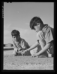Marble game. FSA (Farm Security Administration) camp, Robstown, Texas. Sourced from the Library of Congress.