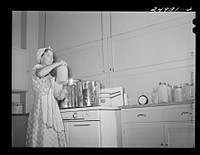 Harlingen, Texas. FSA (Farm Security Administration) camp. Canning grapefruit for hot weather use in community kitchen. Sourced from the Library of Congress.