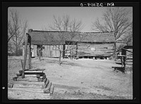 Dog-run log cabin in which Joe Handley, tenant farmer, lives. Walker County, Alabama. Sourced from the Library of Congress.