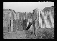 Gees Bend  splitting wood. Alabama. Sourced from the Library of Congress.