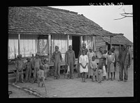 [Untitled photo, possibly related to: es, descendants of former slaves of the Pettway Plantation. They are living under primitive conditions on the plantation. Gees Bend, Alabama]. Sourced from the Library of Congress.