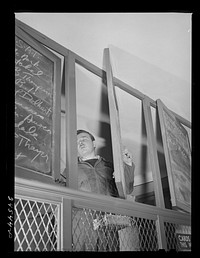 New York, New York. Listing ships in need of sailors at the Hiring Hall of the National Maritime Union. Sourced from the Library of Congress.