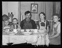 Part of the Valentine family at dinner. Bedford County, Pennsylvania. Sourced from the Library of Congress.