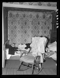 Dalton, Allegany County, New York. Bed and rocker in John Dudeck's home. Sourced from the Library of Congress.