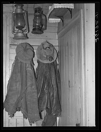 Clothes and lanterns in the farm home of Fred Ess. Near Dalton, New York. Sourced from the Library of Congress.