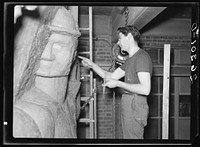 Washington, D.C. Vernon Atchely working at the Special Skills project of the Farm Security Administration on a relief figure for the Greendale school. Sourced from the Library of Congress.